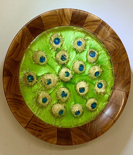 Platter with deep blue center and patterned wood frame