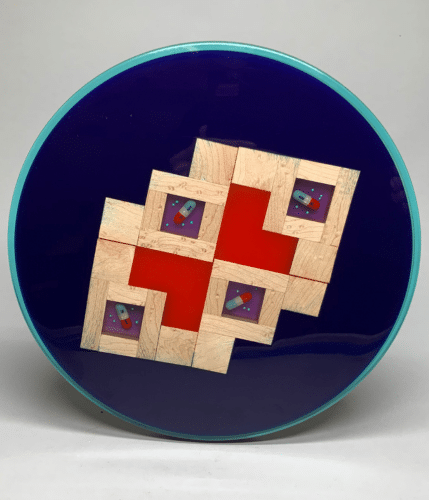 Platter with deep blue center and patterned wood frame